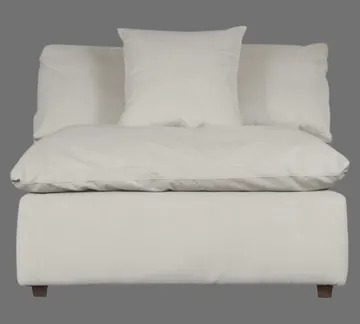 A white couch with pillows on it