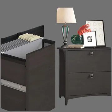 A computer desk and nightstand with lamp.