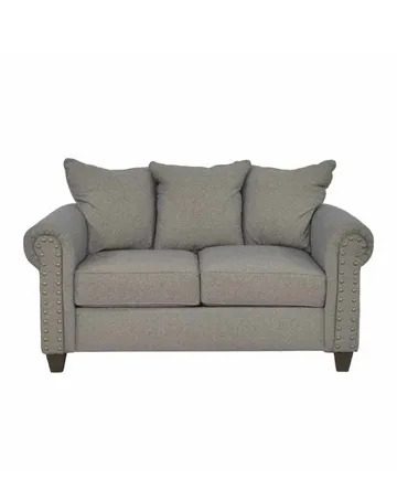 A gray couch with pillows on top of it.