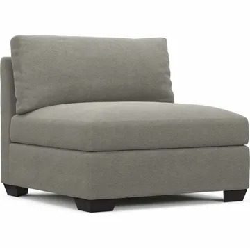 A gray chair with no arms and a cushion on the back.
